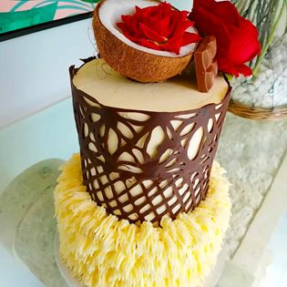 2 tier custom cake with island inspired chocolate wrap 